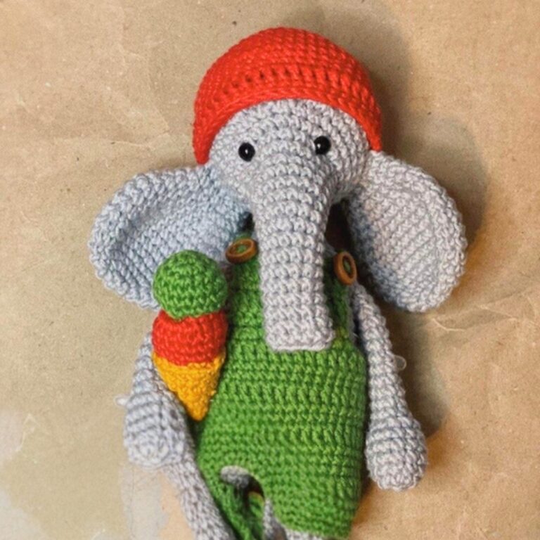 Crochet Elephant Amigurumi With Colorful Hat And Rattle In Hand Pattern
